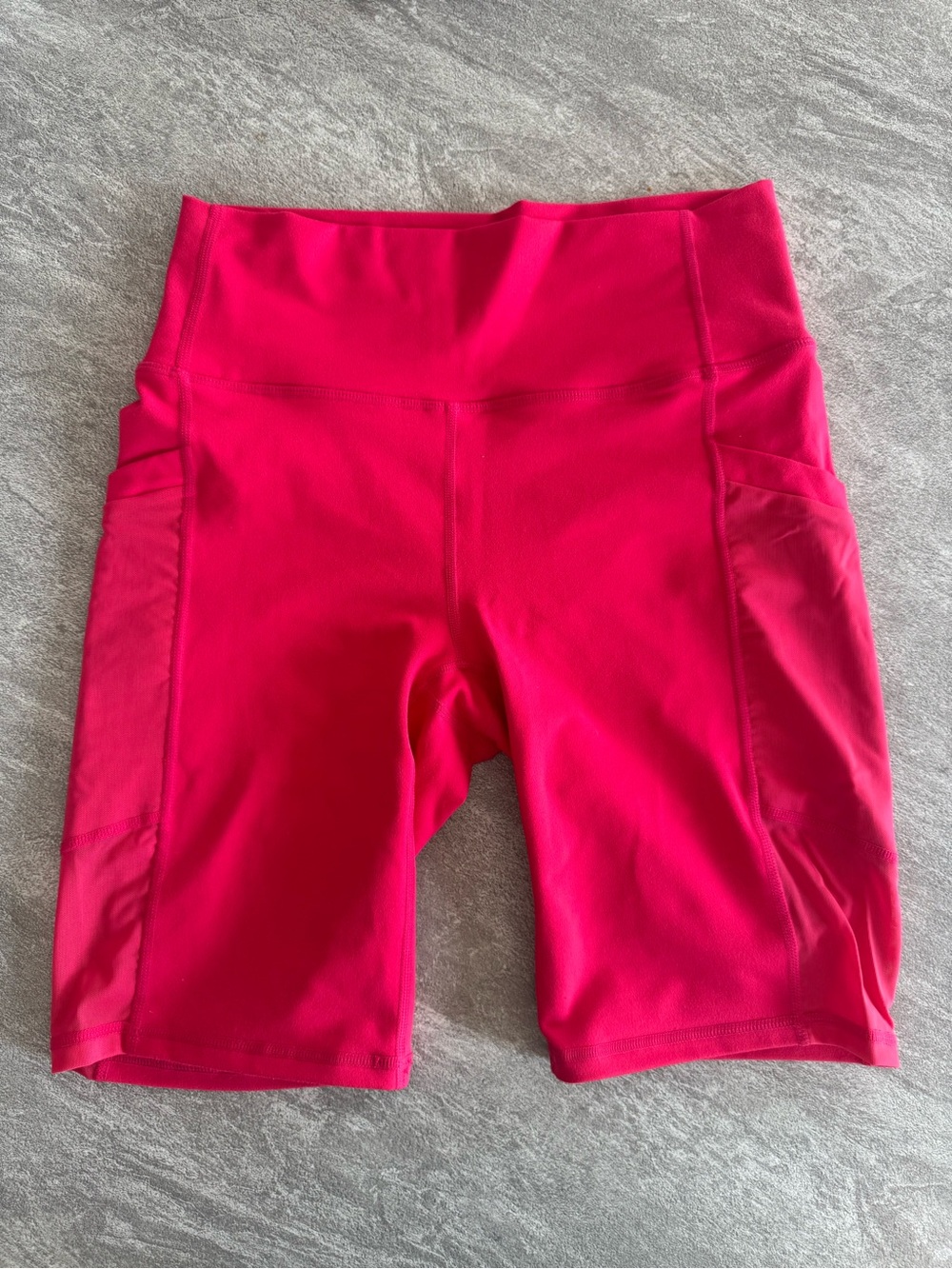 Fabletics PowerHold Hot Pink High-Rise Bike Shorts with Side Pockets